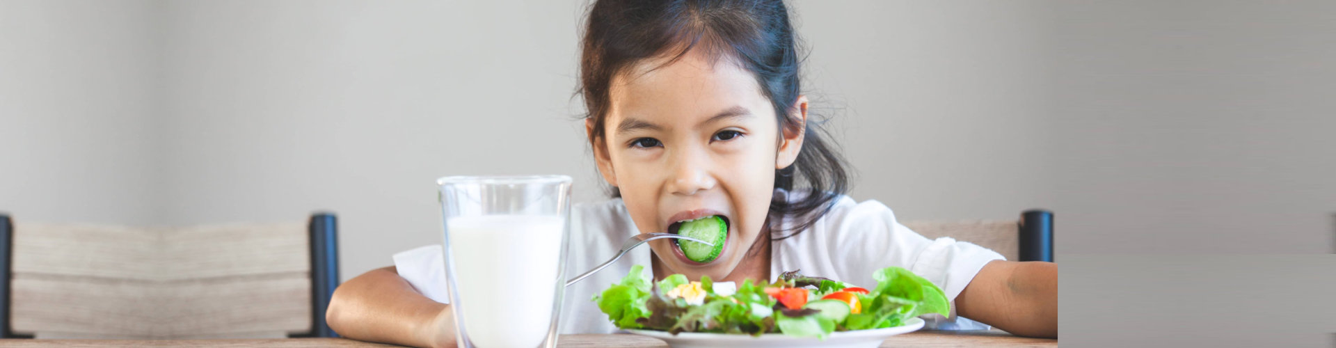 little girl eating healthy foods